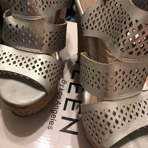 Baddie All silver wedge in new condition